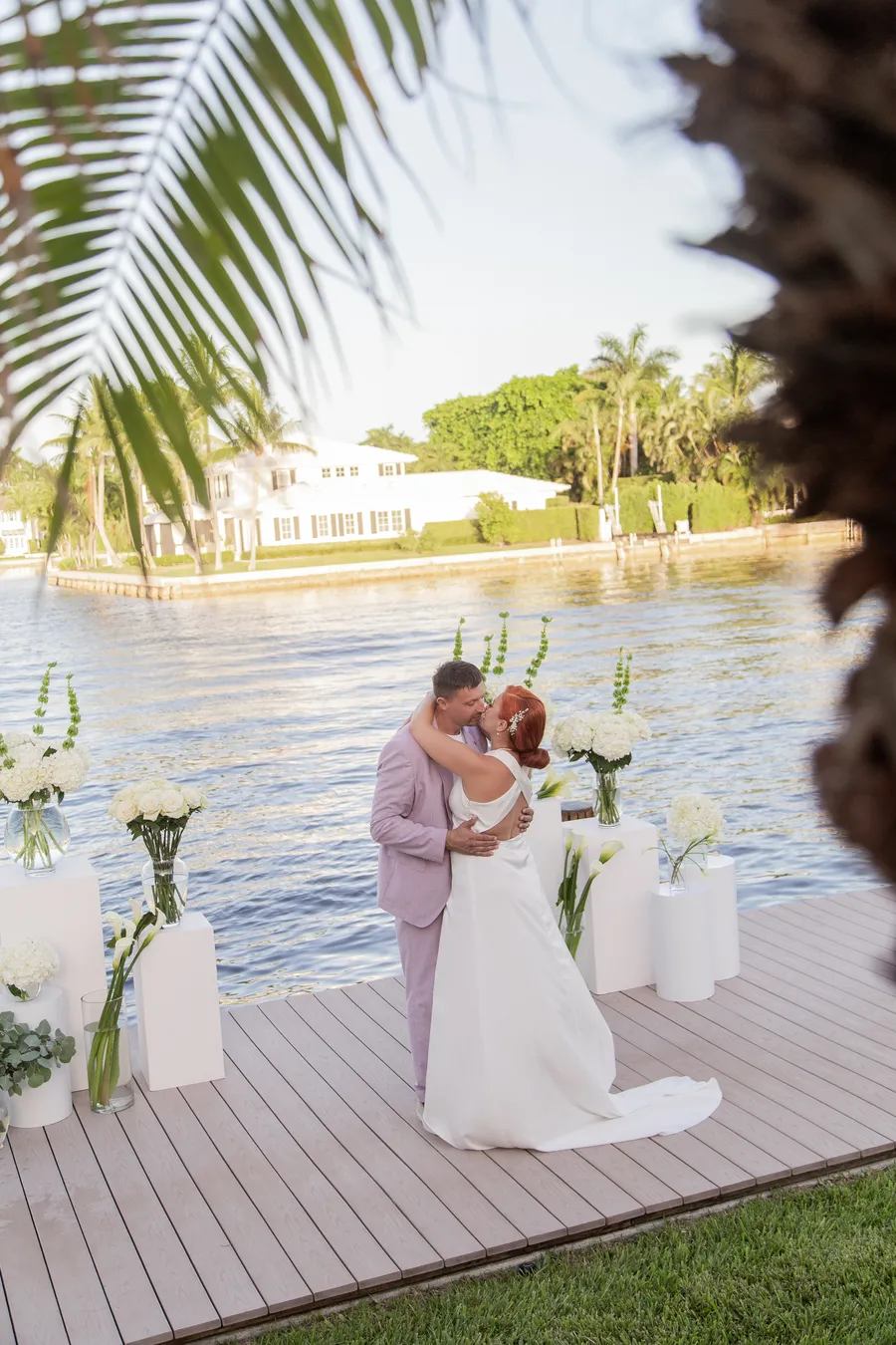Bride and groom celebrating beside the waterfront ceremony — Alexander and Olga wedding
