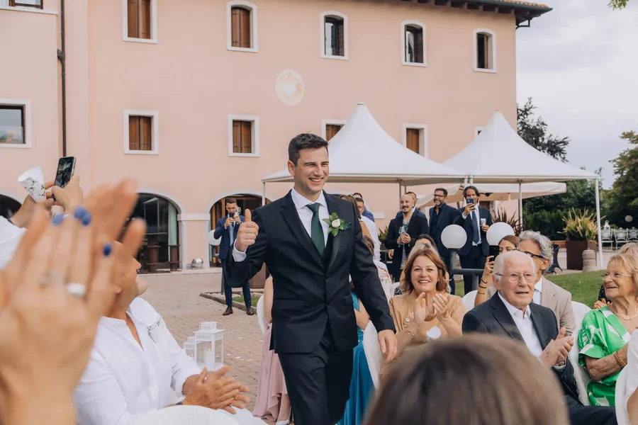 Groom arriving to greet wedding guests — Mattia and Yulia wedding