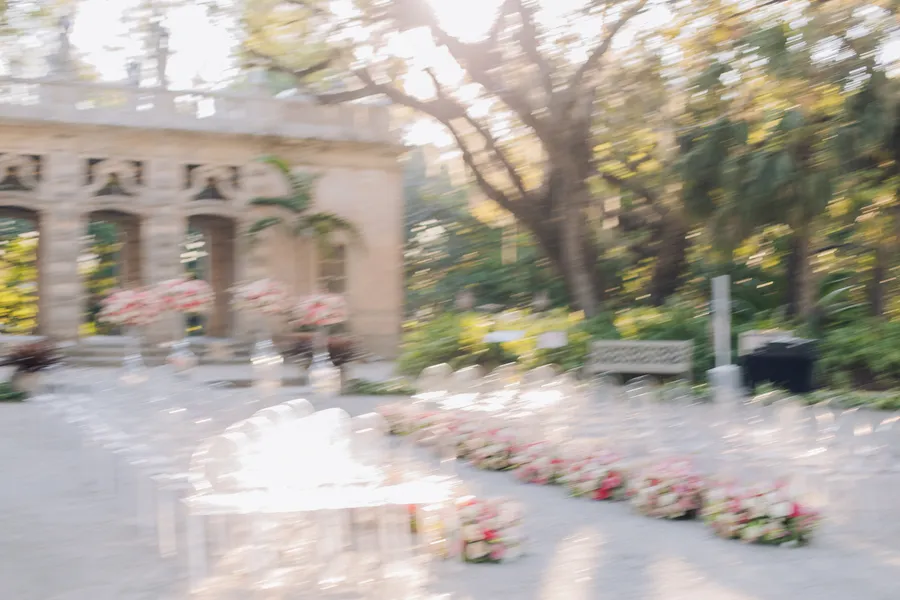 Newlyweds walking through tropical garden grounds — Steven and Iryna wedding