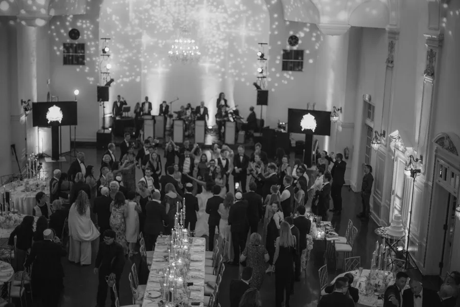 Bride and groom dancing beneath warm reception lights — David and Katia wedding