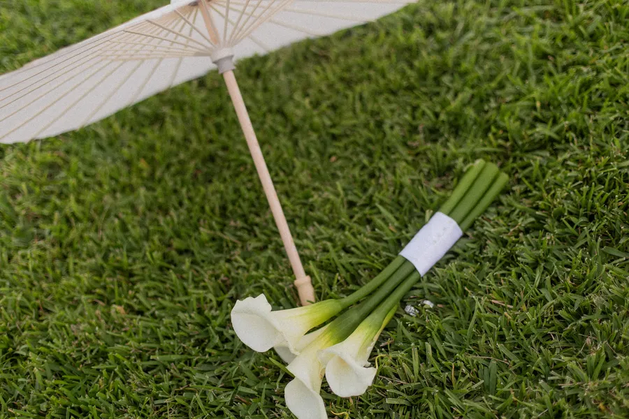 White calla lily wedding detail on the lawn — Alexander and Olga wedding