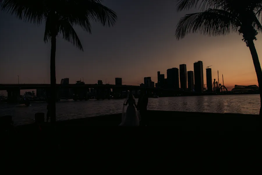 Newlyweds silhouetted against a waterfront sunset — Steven and Iryna wedding