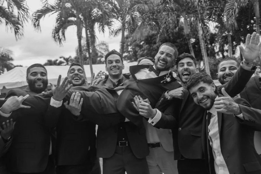 Groom portrait beside a tropical pool — Chris and Laura wedding