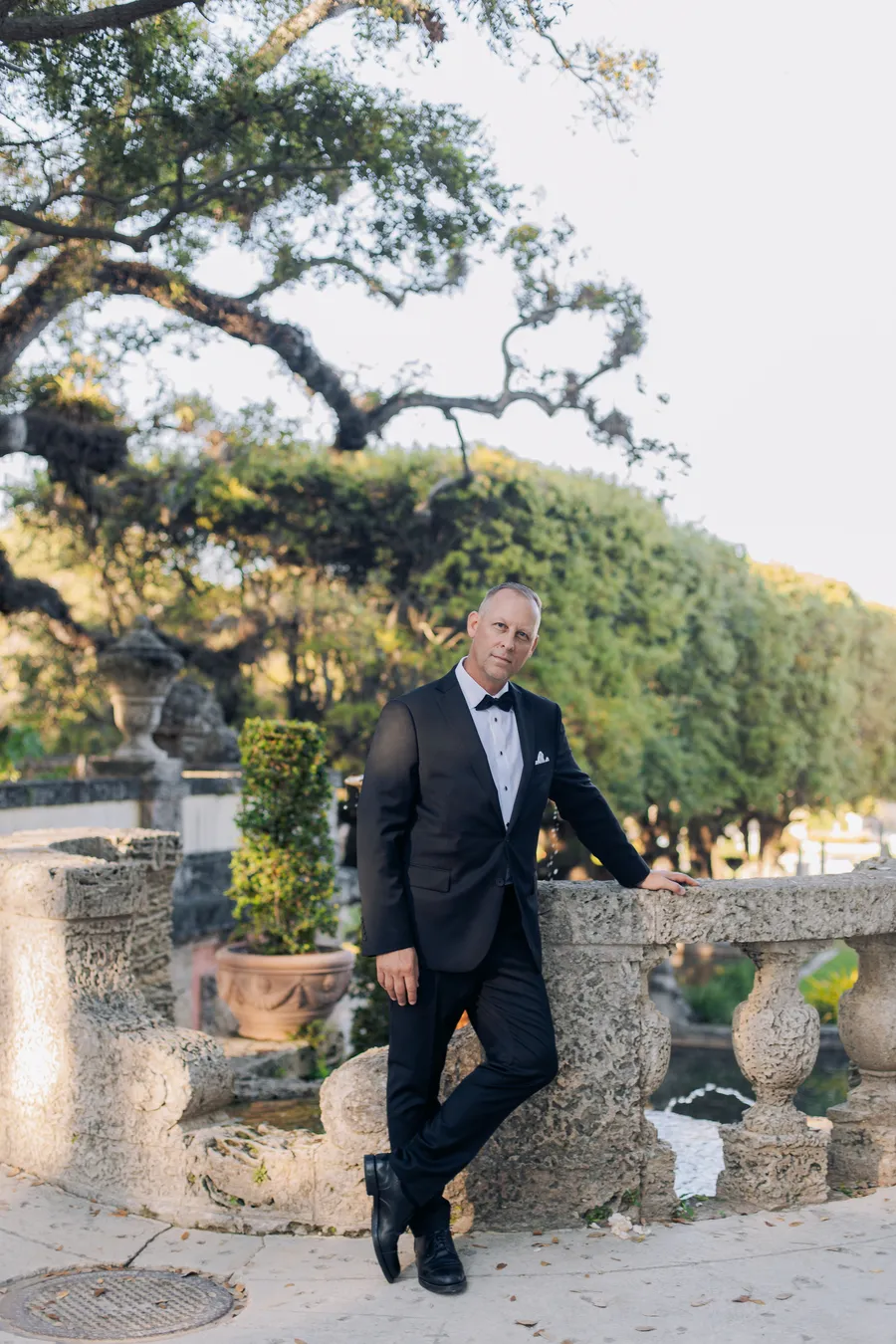 Groom portrait in a formal estate garden — Steven and Iryna wedding