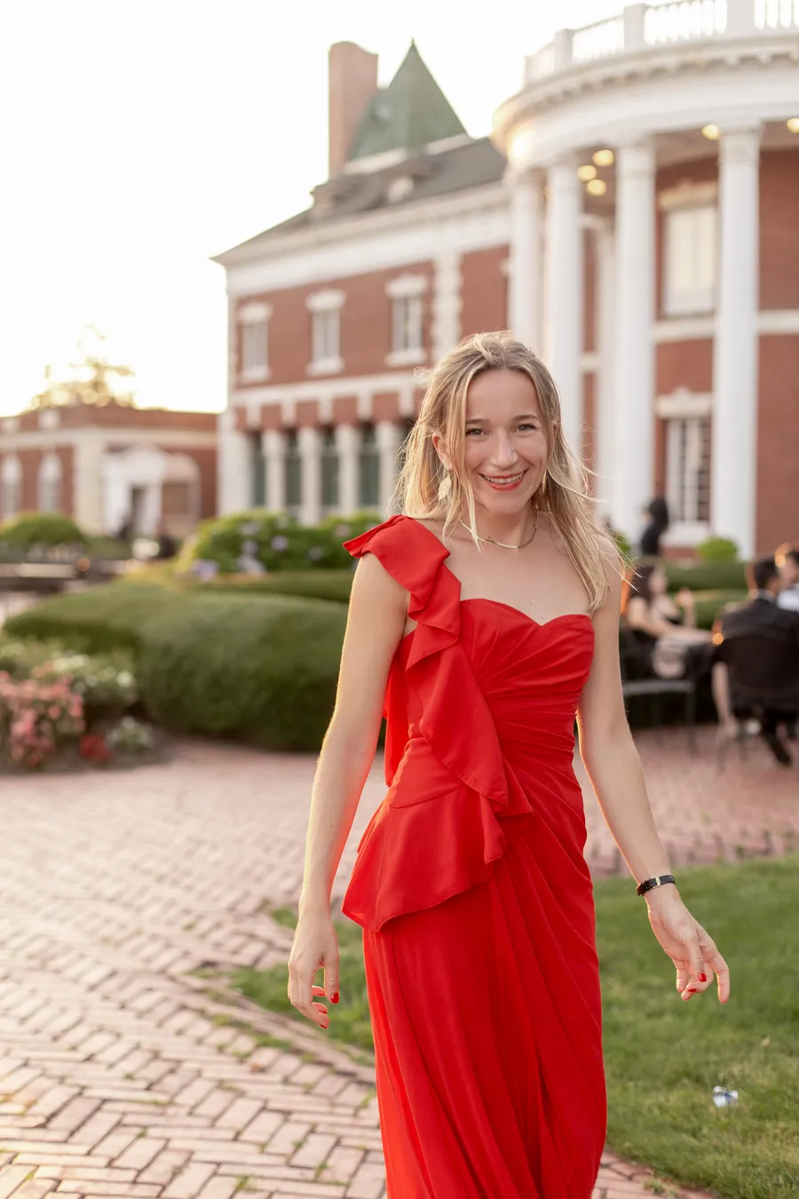 Newlyweds sharing a portrait beside the brick estate — David and Katia wedding