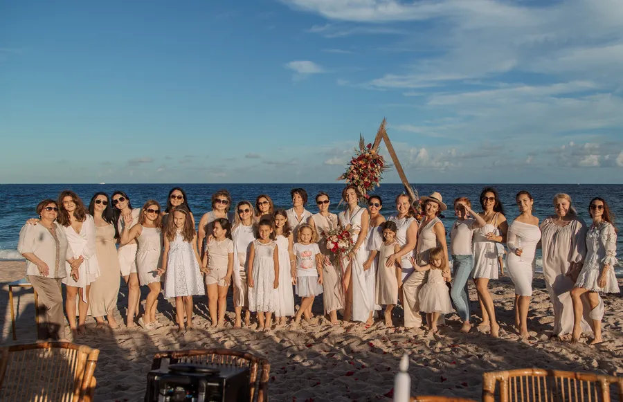 Wedding guests cheering together on the sand — Roman and Victoria wedding