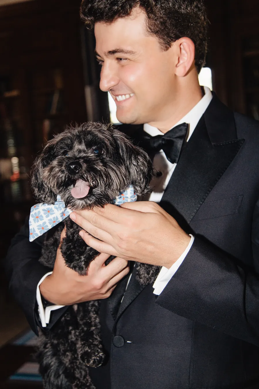 Groom holding the couple’s dog before the ceremony — David and Katia wedding
