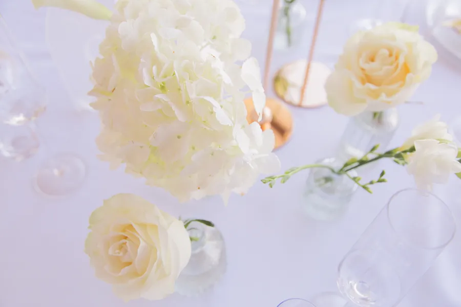 White rose reception detail in bright natural light — Alexander and Olga wedding